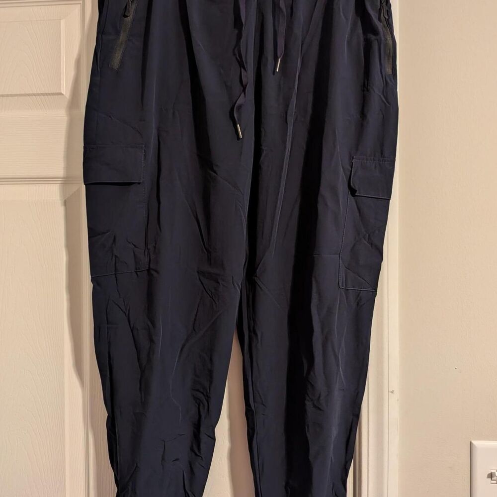 Navy blue cargo pants with adjustable waistband and drawstring